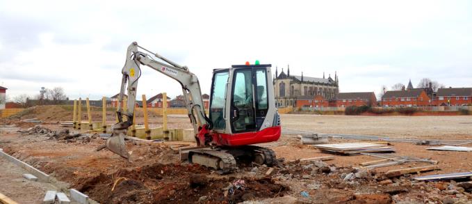 A solitary digger stands empty on the levelled site today, with St Anthonys church, on Scotland Road, one of the only recognisable features left on the landscape