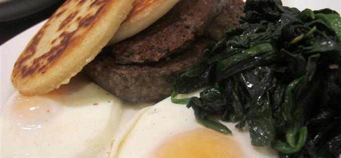 Sad haggis with potato cakes, eggs and spinach