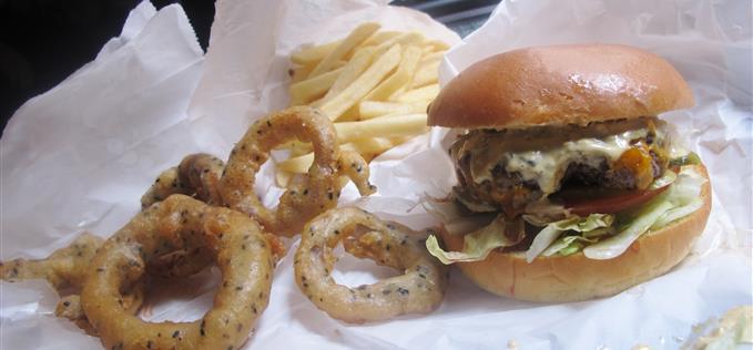 Filthy cheese burger, sad fries and top onion