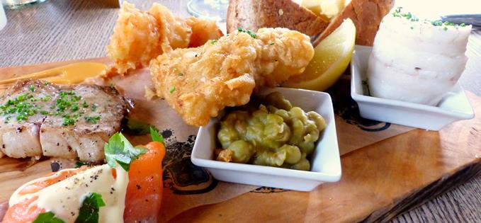 THE COASTAL - £16.95  Tempura king prawns, corn & chilli puree - vodka cured sea bass fillet - chip shop fish & mushy peas - grilled smoked haddock - peppered smoked salmon, citrus hollandaise.