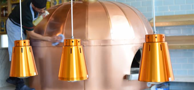 Polishing the new copper pizza over