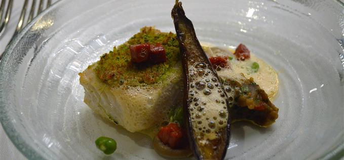 fillet of halibut with broad beans, chorizo, charred baby aubergine and pine nut crumble