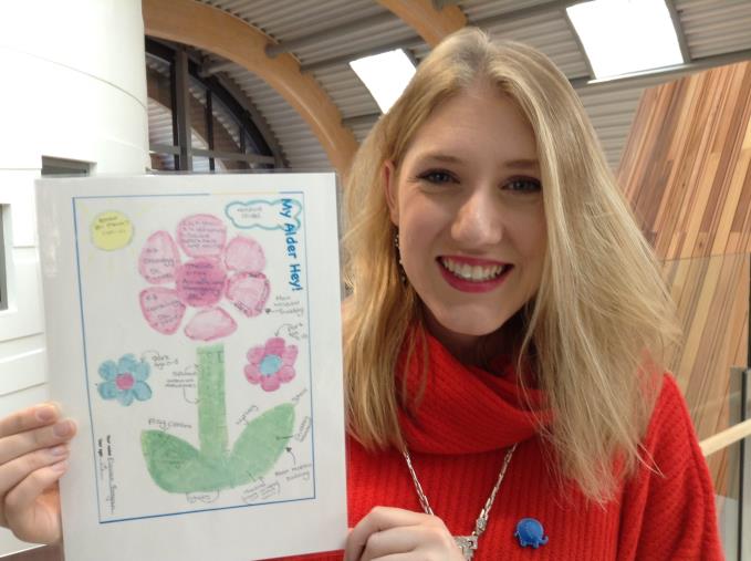 Eleanor Brigan with her winning flower picture which sparked the design for the new hospital