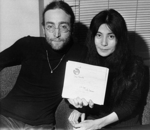 John and Yoko with an exact copy of the letter founding a batch of singles bought for a tenner at a Liverpool car boot sale