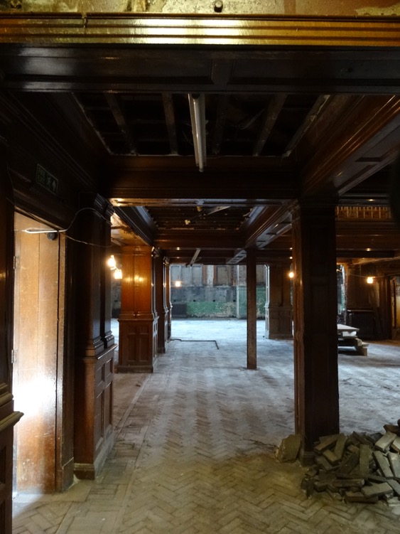 The oak panelling and parquet flooring is largely intact after a decade of neglect