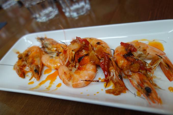 Gambas a la plancha dressed with chilli, garlic and pimento infused olive oil