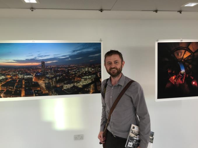 Brooks next to one of his works