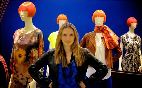 Karen Regn poses with Mary's mannequins