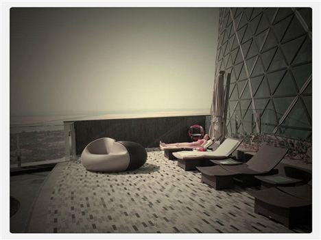 Sun loungers next to the suspended swimming pool at Hyatt Capital Gate