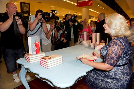 Claire Richards posing for photographs at Selfridges, Trafford Centre