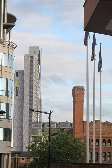 Student Castle by Stephen Hodder, not yet finished, showing up its fine and distinctive profile, together with chimney and flag poles