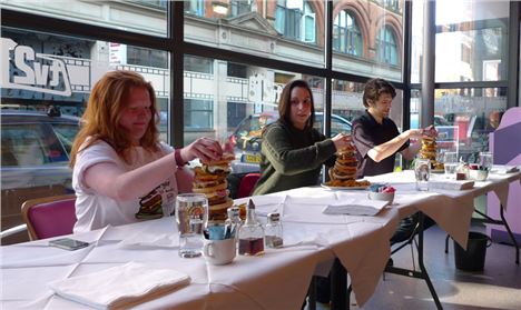 Brave contestants take on the burger tower