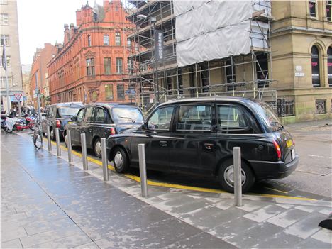 Manchester Hackney Cabs lined up in Spinningfields