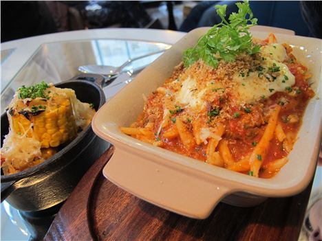 Lovely pasta on a platter, mirrored table beneath