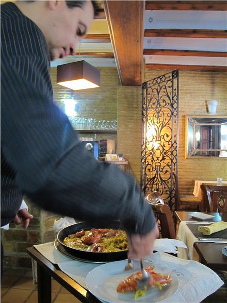 Serving Paella In Chust Godoy