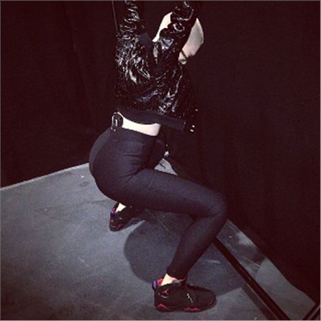 Jessie J does the squat challenge.