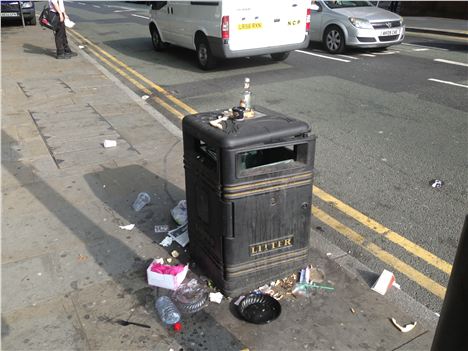 The bin's been emptied but the scum left all about - bad practice