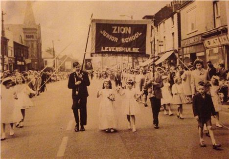 Stockport Road, Levenshulme, 1952. Lynda's Great Uncle to the left, holding a banner during the Whit Walks