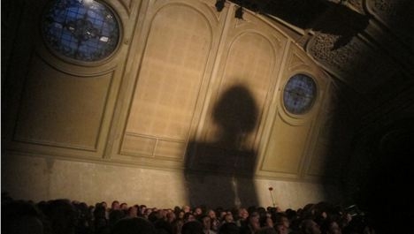 Alison Goldfrapp shadow hits the back wall of Albert Hall during her Manchester International Festival performance