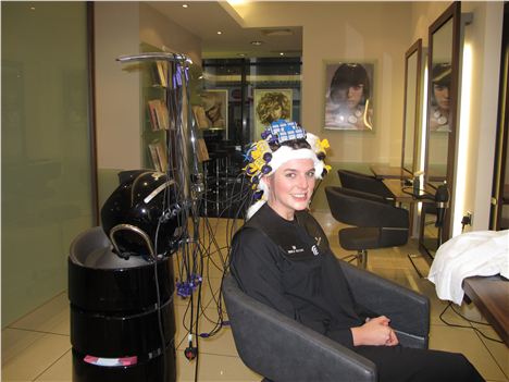 Helen's rollers are heated up using the digital perm technology