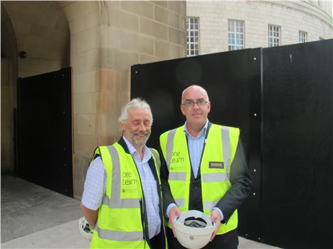 Alan Garbutt, construction director, has a smiley nap while Neil MacInnes, head of libraries, wants something putting in his helmet