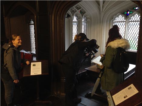 Filming and tweeting an important book on an important table