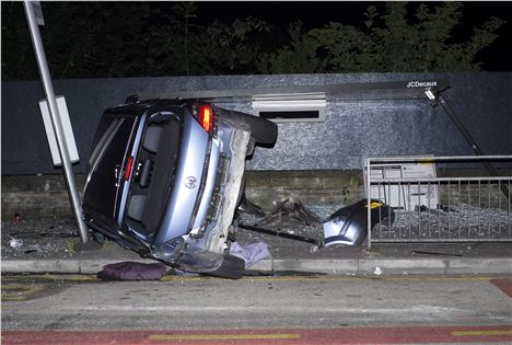 Patel's car and the destroyed bus shelter