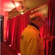 Red curtain, yellow man