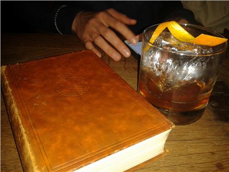 The menu, a hand, a drink