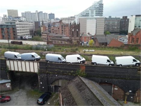 The current Liverpool Lime Street to Manchester Victoria with vans backed up