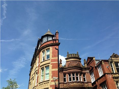 Spot the man on the edge looking down on Manchester, sun on his back, beer in his hand