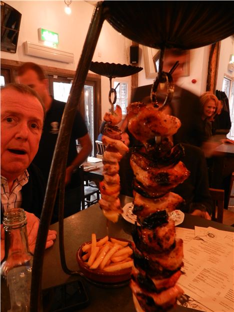 A hanging kebab and a big faced man