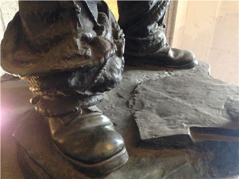 Detail of the boots, with sagging, mud-heavy, puttees