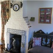 The Cottage's Cosy Fireplace