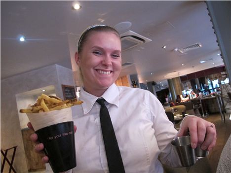 A big smile and some chips plus a small silver tub of thing