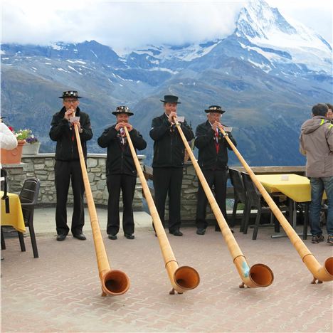 Blowing Their Alpine Horns At The Hotel Reached By The New Sunnegga Funicular