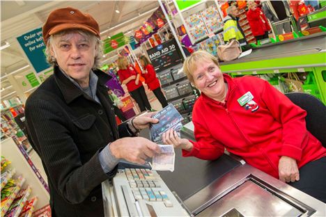 Geldof gets his hands on the first copy of the CD at Trafford Park Asda