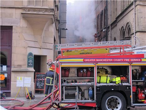 Smoke billows from the back of Carlton House