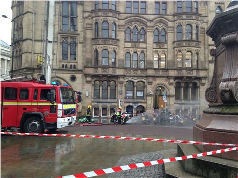 Firefighters prepare hoses