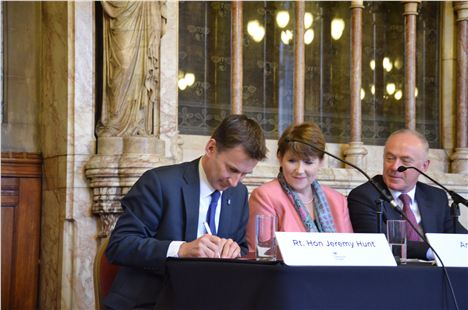 Health Secretary, Jeremy Hunt, puts pen to paper